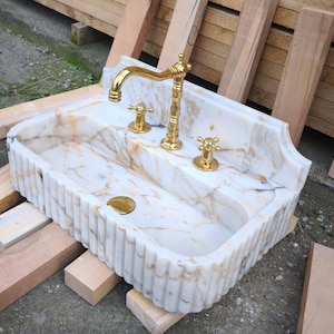 Upgrade your vanity with a marble sink top or a marble vanity sink in gorgeous carrara marble or calacatta monet marble. Our sinks combine elegance with functionality, offering both wall mounted and pedestal sink options for every design. Luxury marble sinks made from aegean marble, carrara, and calcutta marble. Wall-mounted, pedestal, and floating styles available. Shop handmade marble sinks crafted from Turkish stone. Explore calacatta, carrara, viola marble sinks for bathrooms and kitchens.