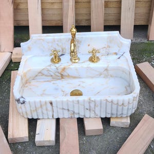 Handmade in Turkey, our marble kitchen sinks and utility sinks are carved from rich stones like ata marble and aegean marble. Whether you need a workstation sink or a charming farmhouse sink, our marble adds a luxurious touch. Transform your space with a marble wall sink or marble countertop sink. Featuring calacatta marble, travertine, and italian marble sinks. Luxury marble sinks made from aegean marble, carrara, and calcutta marble. Wall-mounted, pedestal, and floating styles available.