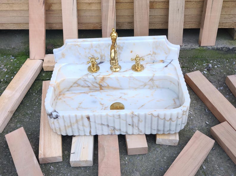 Handmade in Turkey, our marble kitchen sinks and utility sinks are carved from rich stones like ata marble and aegean marble. Whether you need a workstation sink or a charming farmhouse sink, our marble adds a luxurious touch. Transform your space with a marble wall sink or marble countertop sink. Featuring calacatta marble, travertine, and italian marble sinks. Luxury marble sinks made from aegean marble, carrara, and calcutta marble. Wall-mounted, pedestal, and floating styles available.