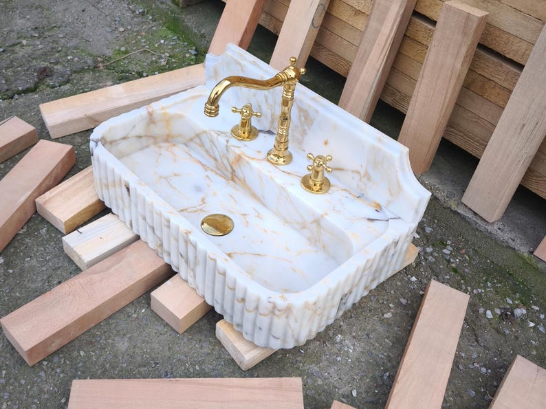 Looking for a unique marble sink? Our marble vessel sinks and marble countertop sinks are sculpted from premium stones like arabescato marble and calacatta gold marble. Add elegance to your bathroom with a true piece of art. Discover luxury marble vessel sinks, floating sinks, and integrated sinks. Perfect for elegant bathroom and kitchen upgrades. Custom orders available! Handmade marble sinks: calacatta sink, viola sink, carrara sink. Wall mounted, floating, and farmhouse marble sink designs.