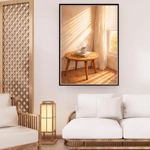 May include: A framed watercolor painting depicts a small, round wooden table with a coffee cup and books. Sunlight streams through a window, casting shadows. The scene evokes a sense of calm and warmth, perfect for home decor.