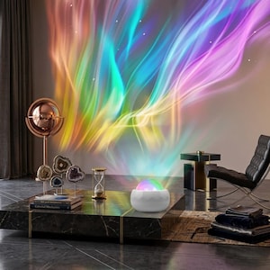 May include: A white, spherical night light projects colorful, swirling light patterns onto a wall. The room features a modern coffee table with decorative items, a copper-toned sculpture, and a black leather chair.