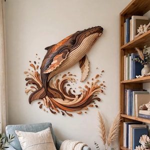 May include: A multi-layered wooden wall art piece depicting a humpback whale breaching from stylized waves. The sculpture is crafted from various shades of natural wood, ranging from light tan to dark brown, creating a textured, three-dimensional effect.