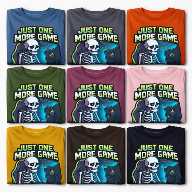 a collection of t-shirts with a cartoon skeleton playing a video game, accompanied by the text "Just one more game".