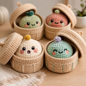 May include: Four crocheted plush dumplings with embroidered faces and small pom-poms on top, each nestled inside a round, tan crocheted basket with a matching lid. The dumplings are light green, pink, cream, and mint green with pink cheeks.