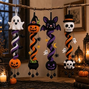 May include: Four hanging crochet Halloween decorations featuring a ghost, a pumpkin, a bat, and a skull. Each ornament has a spiraling body in orange, purple, black, and white, accented with small dangling charms like spiders, stars, and moons.