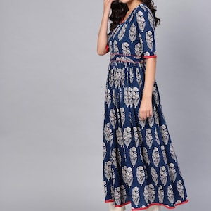 May include: A navy blue maxi dress with a white floral pattern. The dress features short sleeves, a V-neckline, and red trim along the neckline, waist, and hem. The dress is floor-length and has a flowing silhouette.