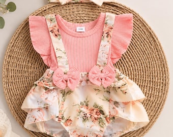 Rosa blommig babysparkdräkt med rosett i pannband och ribbad gylfärm som sommaroutfit