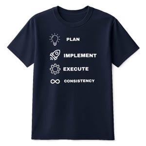 May include: A navy blue short-sleeved t-shirt featuring a white graphic design with four rows. Each row contains an icon and text: a lightbulb with the word PLAN, a rocket with IMPLEMENT, a gear with EXECUTE, and an infinity symbol with CONSISTENCY.