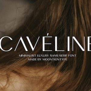 May include: Image showing the word "CAVELINE" in a minimalist sans serif font. The text is white against a blurred background of brown hair and skin. The text below reads "MINIMALIST LUXURY SANS SERIF FONT MADE BY MOONTION TYPE".