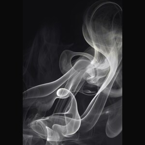 May include: Abstract black and white image featuring swirling, wispy smoke. The smoke appears in shades of gray and white against a dark background. The smoke has a soft, ethereal quality, with smooth, flowing lines and curves.