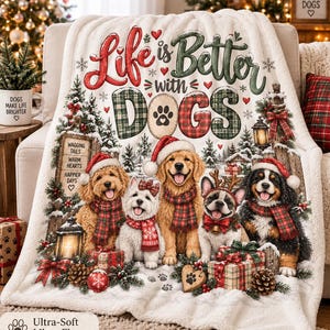 May include: A white micro fleece blanket featuring the text Life is Better with DOGS and a graphic of five dogs wearing Christmas hats and plaid scarves. The design includes snowy pine trees, lanterns, wrapped gifts, and pinecones. Measures 50 by 60 inches.