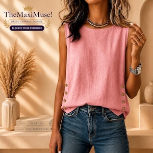 May include: A sleeveless pink top featuring a round neckline and a row of three brown buttons along each side hem. The garment is paired with blue denim jeans. The text TheMaxiMuse! DRESS. EXPRESS. INSPIRE. ELEVATE YOUR EVERYDAY is visible.