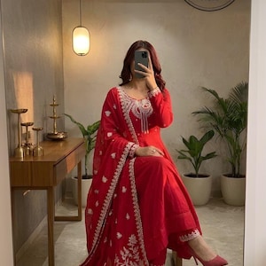 May include: A set of three ceramic mugs with a speckled, matte finish. The mugs are in shades of cream, light gray, and dark gray. Each mug has a simple, minimalist design and a rounded handle.