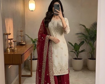Pakistaans wit sharara-pak voor vrouwen met opeenvolgend borduurwerk