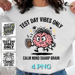 May include: A light gray sweatshirt with the text "TEST DAY VIBES ONLY" and "CALM MIND SHARP BRAIN". The graphic features a pink brain holding a coffee cup and a pencil. The image also includes three smaller graphics with the same text and brain design.