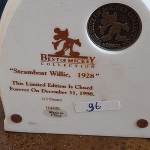 May include: A collectible "Best of Mickey Collection" figurine, featuring "Steamboat Willie, 1928." The text indicates it is a limited edition, closed on December 31, 1998. Includes a Disney logo and a "Made in China" sticker.