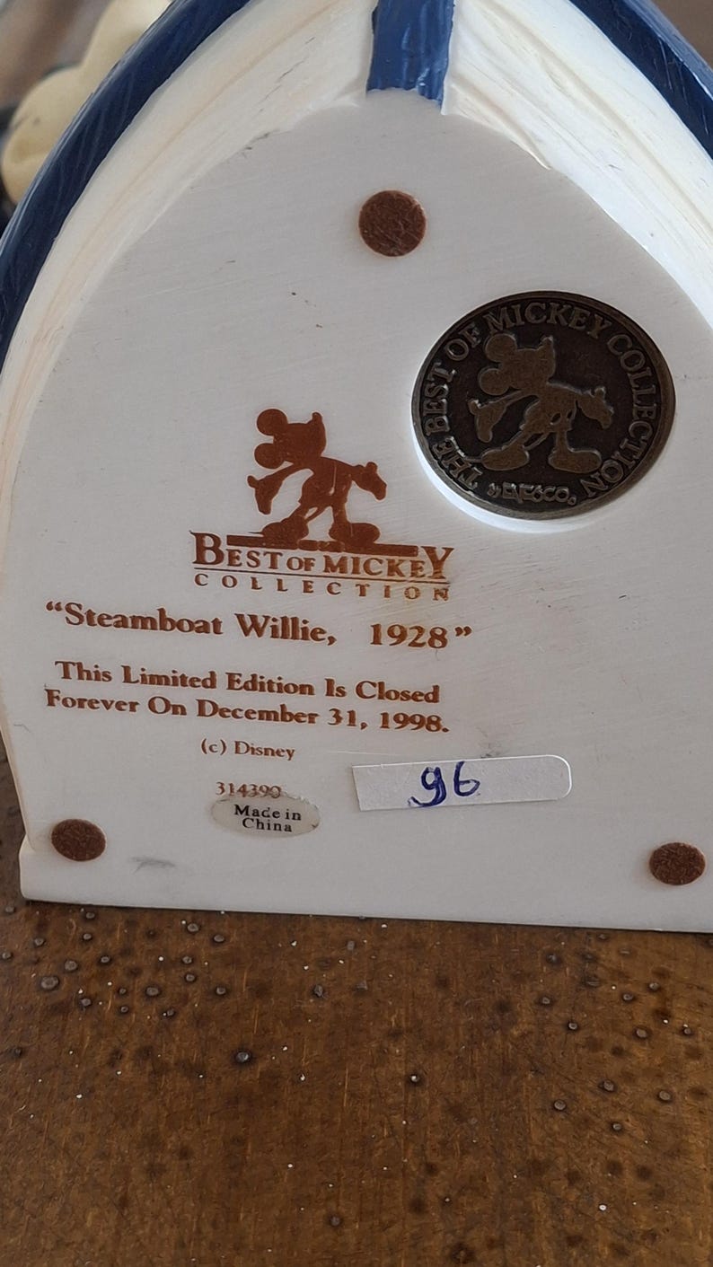May include: A collectible "Best of Mickey Collection" figurine, featuring "Steamboat Willie, 1928." The text indicates it is a limited edition, closed on December 31, 1998. Includes a Disney logo and a "Made in China" sticker.
