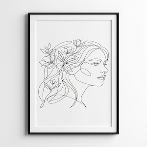 Peut inclure: Impression d'art encadrée en noir représentant un dessin au trait minimaliste d'un profil de femme. Ses cheveux sont ornés d'éléments floraux. L'œuvre est un design simple et élégant, idéal pour la décoration intérieure moderne.