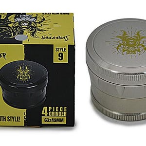 May include: A silver 4-piece grinder with a matching box. The grinder has a textured grip and a gold-colored design on the lid. The box is black and yellow, with the word "Shredder" and "Shred with Style!" printed on it. The box dimensions are 63x49mm.