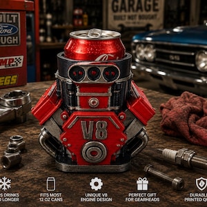May include: A red and black V8 engine-shaped beverage can cooler holding a red 12 oz soda can. The cooler features a detailed engine block design with silver accents. Text at the bottom reads: KEEPS DRINKS COLD LONGER, FITS MOST 12 OZ CANS, UNIQUE V8 ENGINE DESIGN, PERFECT GIFT FOR GEARHEADS, DURABLE 3D PRINTED QUALITY.