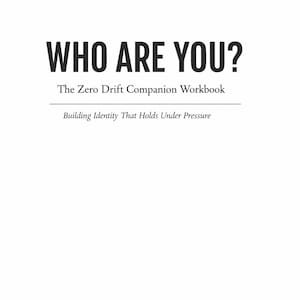 May include: A white book cover with the title "WHO ARE YOU?" in bold black letters. Below, it reads "The Zero Drift Companion Workbook" and "Building Identity That Holds Under Pressure." The publisher's name, "Zero Drift Press," is at the bottom.