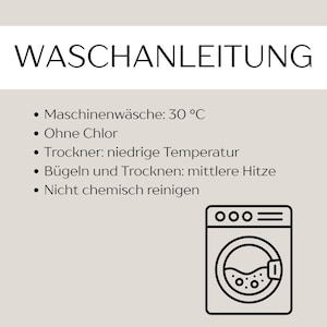 May include: A beige informational sign with the heading WASCHANLEITUNG and a list of laundry instructions in German, including machine wash at 30 degrees Celsius, no chlorine, low heat tumble dry, medium heat iron, and no dry cleaning, with a washing machine icon.