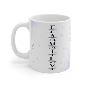 May include: A white ceramic mug featuring a vertical black text design that spells FAMILY with the words Father, And, Mother, I, Love, You integrated horizontally between the letters. The mug has a light purple watercolor floral pattern.