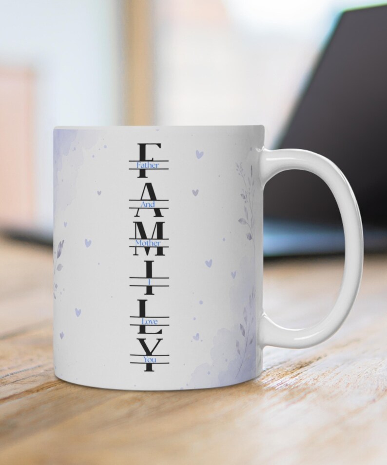 May include: A white ceramic mug featuring a vertical black text design that spells FAMILY, with smaller blue text reading Father And Mother I Love You integrated between the letters. The mug has a light purple watercolor floral and heart pattern.