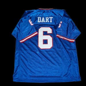 May include: Blue mesh jersey with the name "DART" and the number "6" in white on the back. The jersey has red and white trim on the sleeves and collar. The jersey is displayed against a black background.