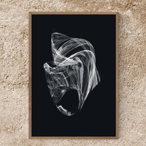 May include: Abstract art print featuring a swirling, translucent white form against a stark black background. The artwork is framed in a simple wooden frame, creating a striking contrast. The piece evokes a sense of movement and ethereal beauty, suitable for modern decor.