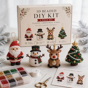 May include: A 3D beaded DIY kit for 4 Christmas ornaments featuring Santa, a snowman, a reindeer, and a tree. The set includes a box with product images, a plastic container with assorted colored beads, a spool of thread, a needle, and instructions.