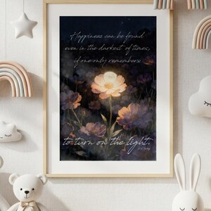 May include: A framed print with a floral design and the quote, "Happiness can be found even in the darkest of times, if one only remembers to turn on the light." The room is decorated with pastel rainbows, stars, clouds, and stuffed animals, creating a nursery theme.