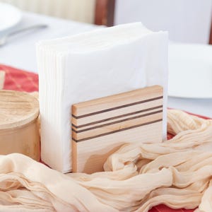 May include: A set of three ceramic mugs with a speckled, matte finish. The mugs are in shades of cream, light gray, and dark gray. Each mug has a simple, minimalist design, perfect for coffee or tea.