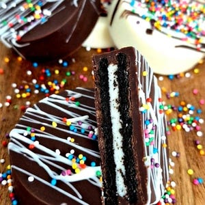 May include: A set of three ceramic mugs with a speckled, matte finish. The mugs are in shades of cream, light gray, and dark gray. Each mug has a simple, minimalist design, perfect for coffee or tea.