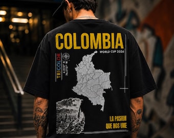 May include: Black t-shirt with a graphic design featuring the word "COLOMBIA" in yellow, a map outline, and the text "WORLD CUP 2026." The shirt also includes the text "TRICOLOR" and "LA PASION QUE NOS UNE."