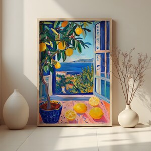 May include: A framed painting depicts a vibrant lemon tree in a blue pot, set against a coastal view. The artwork features a window with a view of the sea and lemons on a table. The color palette includes blues, yellows, and greens.
