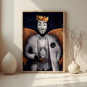 May include: Framed art print featuring a figure in a white mask, gold crown, and orange wings, holding a geometric object. The figure wears a gray suit with a black bow tie and a black rose. The background is dark with gold accents.