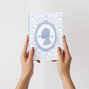 May include: A trio of cream-glazed ceramic mugs, each adorned with a hand-painted floral pattern in blue, green, and yellow. The mugs have a speckled finish and a classic, rounded design with easy-grip handles. Ideal for tea or coffee.