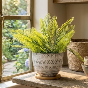 May include: A set of three ceramic mugs with a speckled, matte finish. Each mug features a different color: light blue, cream, and gray. The mugs have a simple, modern design, perfect for coffee or tea.