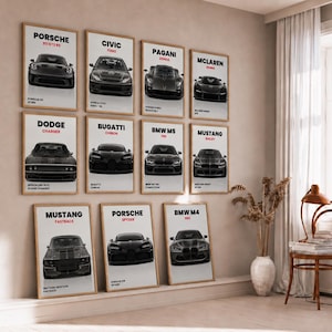 May include: A collection of eleven framed vertical posters featuring black and white illustrations of various sports cars including Porsche, Civic, Pagani, McLaren, Dodge, Bugatti, BMW, and Mustang, each labelled with the car make and model name.