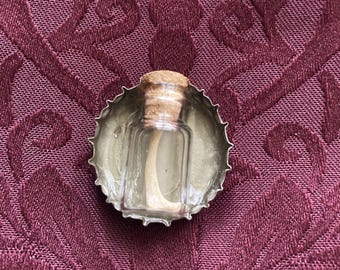 Skunk Bone- Bottle Cap Pin