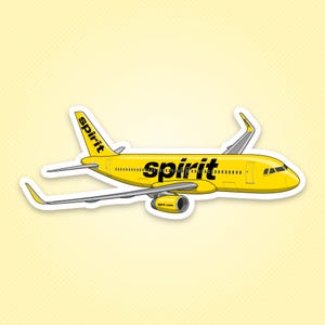 May include: A yellow airplane sticker featuring the black text spirit on the fuselage and the tail fin. The aircraft has a single engine visible under the wing, a cockpit window, and a series of small passenger windows along the side of the body.
