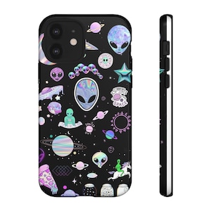 May include: Black phone case featuring a vibrant, colorful alien-themed design. The case is covered in various alien illustrations, planets, stars, and the words "SPACED OUT" and "I NEED MY SPACE". The case has a black border.