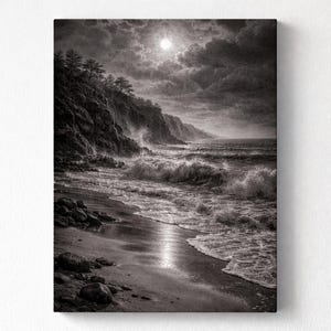 May include: Black and white print of a coastal scene. The image depicts a moonlit beach with crashing waves, a rocky cliff, and a cloudy sky. The artwork is a grayscale landscape.