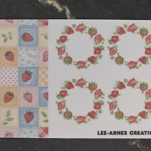 May include: A rectangular sticker sheet featuring a patchwork pattern of pastel squares with strawberries, leaves, and polka dots on the left side. The right side displays six circular strawberry wreaths on a white background with the text LEE-ARNES CREATIONS FOR YOU.