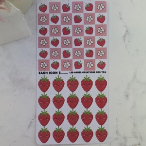 May include: A sticker sheet with red strawberries and white flowers on a pink and white chequered background. Below, there are rows of smiling strawberry stickers. The text "EACH ICON $... LEE-ARNES CREATIONS FOR YOU" is printed at the bottom.