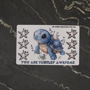 May include: A rectangular white card featuring a central illustration of a blue turtle surrounded by lavender sprigs. Six grey starfish icons are arranged on the sides with dollar amounts. Text reads LEE-ARNES CREATIONS FOR YOU and YOU ARE TURTLEY AWESOME.
