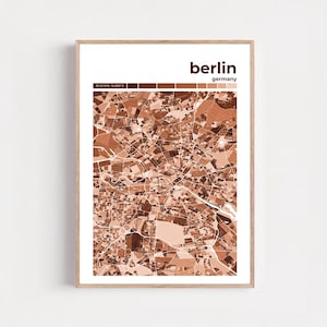 Puede incluir: Una impresión enmarcada que presenta un mapa detallado de Berlín, Alemania, en tonos marrones y blancos. El nombre de la ciudad se muestra en una fuente moderna en la parte superior, con "Germany" debajo. El mapa es una representación geométrica.
