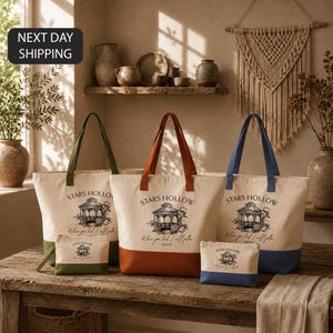 a collection of tote bags and a small bag, all featuring the same design and text, arranged on a wooden surface.